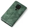 A green flip cover case for a Xiaomi Redmi Note 9 phone, shown from a top-down diagonal angle. Produktbild-Vorschau