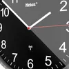 A close-up view of a Mebus analog clock face, showing the hour and minute hands, numbers, and brand logo. Anteprima dell’immagine prodotto