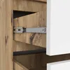 A close-up view of an open drawer in a wooden cabinet, showing the drawer slides and the interior of the cabinet. Podgląd zdjęcia produktu