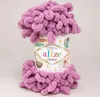 A skein of pink fluffy yarn wrapped around a cylindrical container. Náhled obrázku produktu