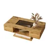 A wooden coffee table with a glass insert and decorative dried flowers in a vase. Produktbild-Vorschau