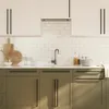 A modern kitchen scene with cabinets and a sink. Produktbild-Vorschau