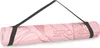 A rolled-up yoga mat with a strap, displayed against a white background. Podgląd zdjęcia produktu