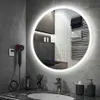 A modern bathroom vanity with a round LED mirror, sink, faucet, and various accessories. Náhled obrázku produktu