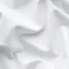 Close-up of white fabric with folds and creases. Produktbild-Vorschau