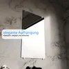 A mirror mounted on a marble-effect wall with a text overlay. Produktbild-Vorschau