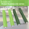Four roller brushes for an iRobot Roomba are displayed in front of a blurred living room background. Podgląd zdjęcia produktu