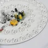 A close-up view of a circular LED light fixture's circuit board and LEDs. Podgląd zdjęcia produktu