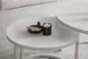 A close-up shot of a coffee table set with a candle and matches. Produktbild-Vorschau