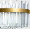 A close-up view of a crystal chandelier with a gold band. Náhľad obrázku produktu