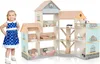 A young child stands next to a large, multi-story wooden dollhouse filled with miniature furniture. Náhled obrázku produktu
