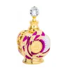 A decorative perfume bottle with a crystal stopper. Voir les images du produit
