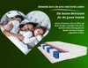 A family sleeping in a heart-shaped frame, with a cutaway view of a mattress below. Voir les images du produit