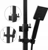 Close-up of a black shower system with a hand shower and a rain shower head. Produktbild-Vorschau