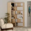 A corner bookshelf unit with books and a decorative lamp. Produktbild-Vorschau