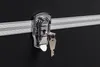 A close-up of a black transport case with a silver lock and key. Produktbild-Vorschau