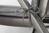 Close-up of a gray tie on a chair cushion. Produktbild-Vorschau