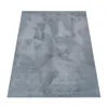 A rectangular rug with a geometric pattern is shown from a slightly elevated angle against a white background. Anteprima dell’immagine prodotto