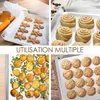 A collage of four images showing different uses of baking sheets, including cookies, cinnamon rolls, roasted potatoes, and more cookies. Voir les images du produit