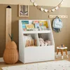 A child's room with a white bookshelf filled with books and toys, a pear-shaped basket, and a height chart. Náhľad obrázku produktu