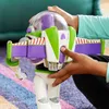 A close-up shot of a Buzz Lightyear action figure being held by two pairs of hands. Voir les images du produit