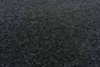 A close-up, textured view of dark gray carpet tiles. Produktbild-Vorschau