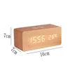 A digital alarm clock with a wooden casing and a wireless charging pad on top, displayed against a white background with dimensions indicated. Produktbild-Vorschau