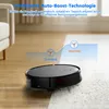 A robotic vacuum cleaner is shown transitioning from a wooden floor to a carpet, illustrating its auto-boost technology. Produktbild-Vorschau