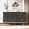 A modern black sideboard with gold geometric accents, displayed in a well-lit room with decorative items on top. Produktbild-Vorschau