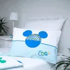 A close-up shot of a pillow with a Mickey Mouse design on a bed. Produktbild-Vorschau