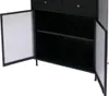 A black cabinet with two doors open, revealing shelves inside. The cabinet has gold-colored knobs on the drawers above the doors. Podgląd zdjęcia produktu