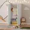 A children's wardrobe in a decorated room with toys and wall art. Anteprima dell’immagine prodotto