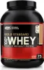 A black and red tub of Optimum Nutrition Gold Standard 100% Whey protein powder. Produktbild-Vorschau