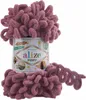 A ball of pink yarn with loops, with a label on the side. Náhled obrázku produktu