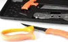 A set of knives and a saw are laid out on a white surface, with some items in a black case. Náhled obrázku produktu