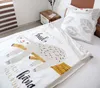 A bed with a sloth-themed duvet cover and pillow. Produktbild-Vorschau