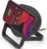 A black wireless charging stand with a smartphone placed on it, displaying a music app. Produktbild-Vorschau