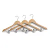 Three wooden hangers with silver clips are displayed against a white background. Produktbild-Vorschau
