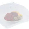 A white mesh food cover is placed over a plate of fruit, including strawberries, raspberries, a banana, and pears. Produktbild-Vorschau