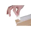 A hand peeling off a protective strip from a cardboard box. Anteprima dell’immagine prodotto