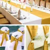 A collage of images showing gold satin table runners and chair sashes, set up for a formal event. Anteprima dell’immagine prodotto