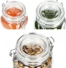 Three glass jars with clamp lids, each containing different food items. Produktbild-Vorschau