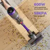 A person is using a cordless vacuum cleaner to clean up debris on a wooden floor. Produktbild-Vorschau
