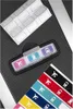 A close-up view of travel-themed stickers and luggage tags. Produktbild-Vorschau