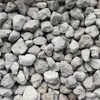 A close-up view of many small, light-colored stones. Produktbild-Vorschau