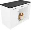 A white kitchen island with a black marble countertop and a dog inside an open compartment. Anteprima dell’immagine prodotto