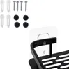 A close-up view of a black shower shelf and its mounting hardware, including screws and wall anchors. Produktbild-Vorschau