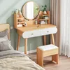 A bedroom scene with a vanity table and a bed. Podgląd zdjęcia produktu