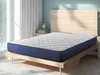 A mattress on a bed frame in a bedroom. Produktbild-Vorschau