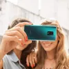 Two young women taking a selfie with a smartphone. Anteprima dell’immagine prodotto